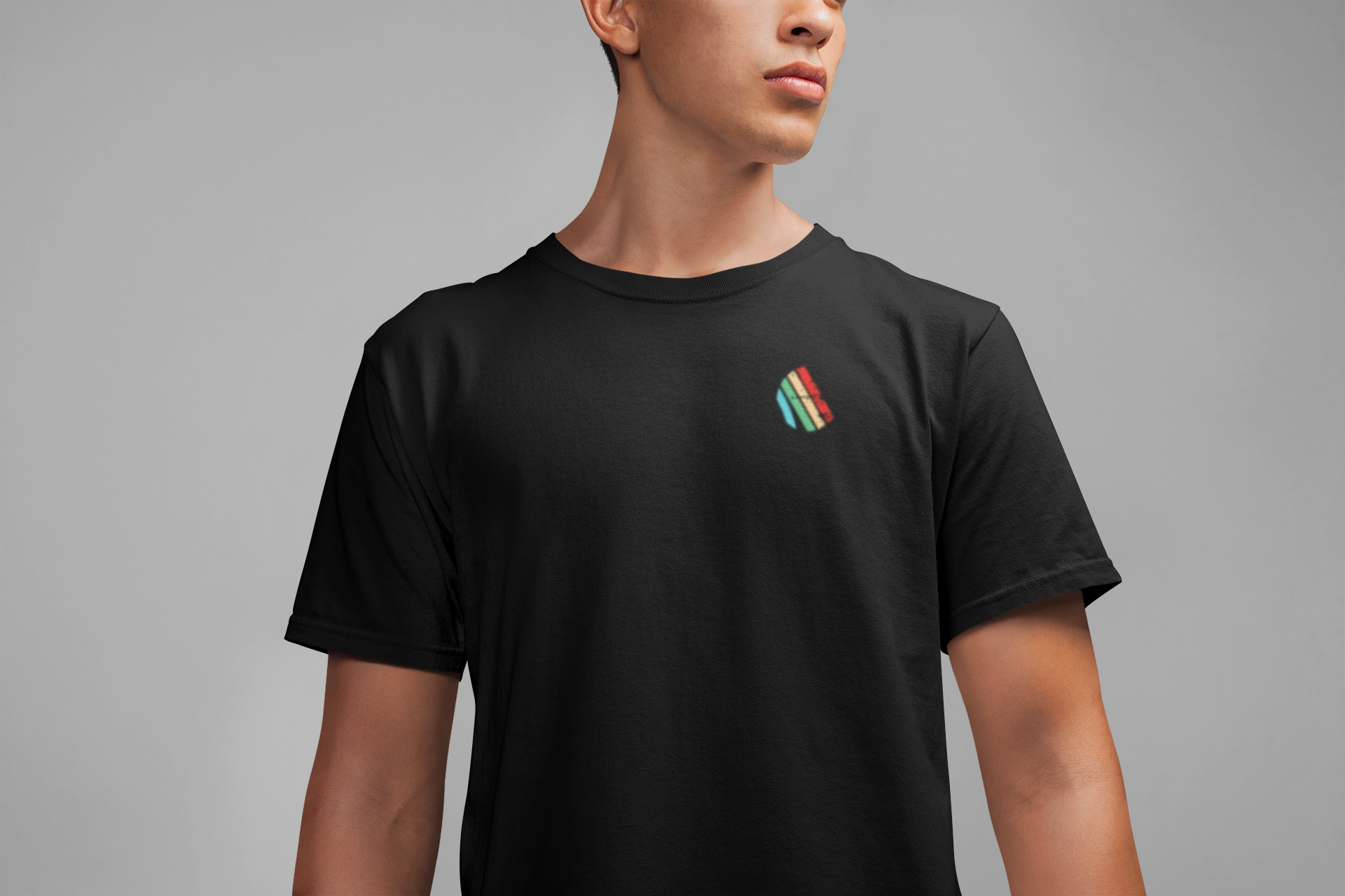 Model wearing black Arc Raiders shirt with minimalist distressed front logo