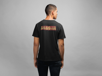 Person wearing a black t-shirt with text on the back against a gray background