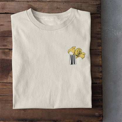 Aerith flower minimal Final Fantasy VII shirt front view with yellow lily pastel design