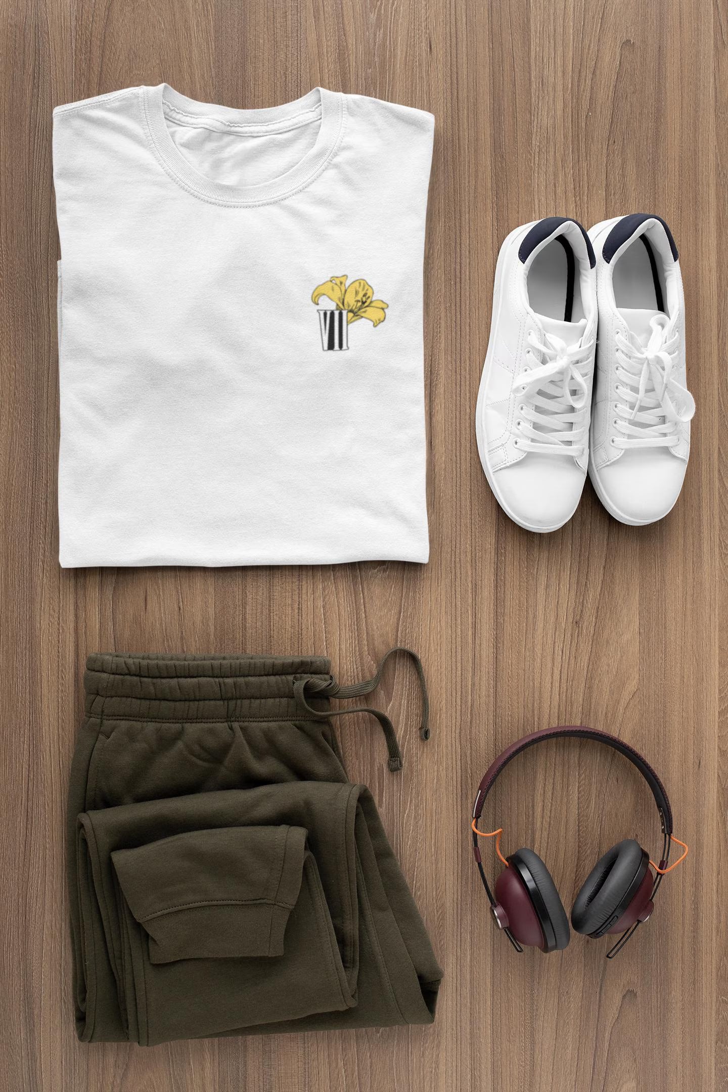 Flat lay of Aerith flower minimal Final Fantasy VII pastel t-shirt with yellow lily graphic