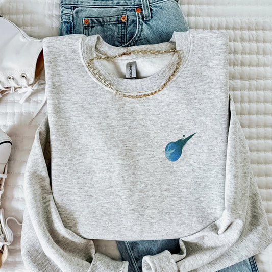 Gray sweatshirt with a blue logo on a white surface