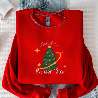 Red Stardew Valley Feast of the Winter Star Christmas sweatshirt with festive winter tree graphic