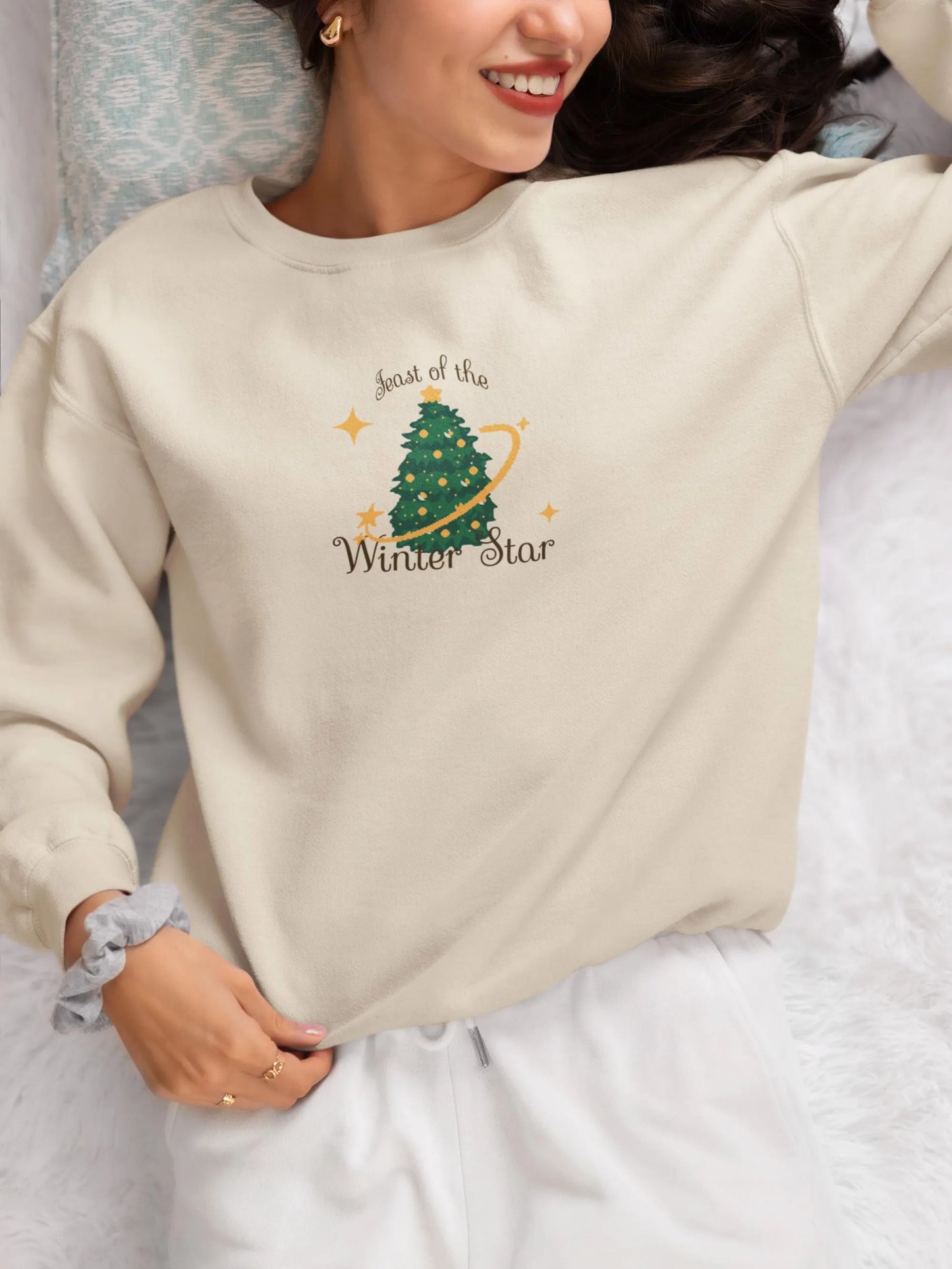 Cream Stardew Valley holiday sweatshirt featuring Feast of the Winter Star design