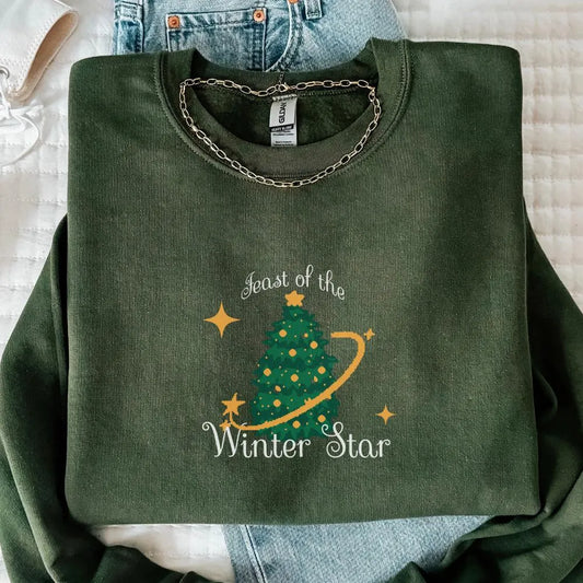Stardew Valley Christmas sweater in forest green featuring Feast of the Winter Star tree design